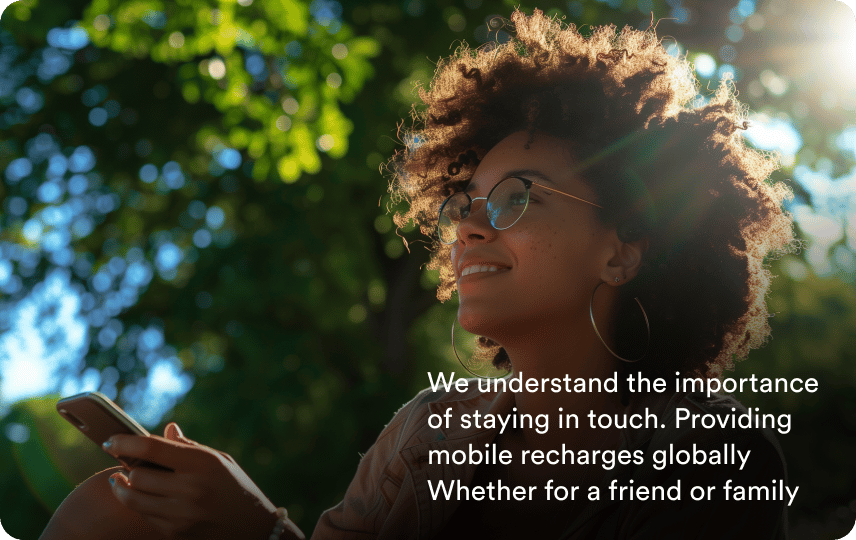 A smiling woman outdoors, with the words: We understand the importance of staying in touch. Providing mobile recharges globally Whether for a friend or family